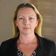 Angie Jennings Unsmiling woman with long blonde hair